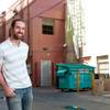 Downtown Las Vegas business owner Michael Cornthwaite stands in an alley Friday, June 8, 2012, that he says has been significantly cleaned up by locals and police over the past few years.